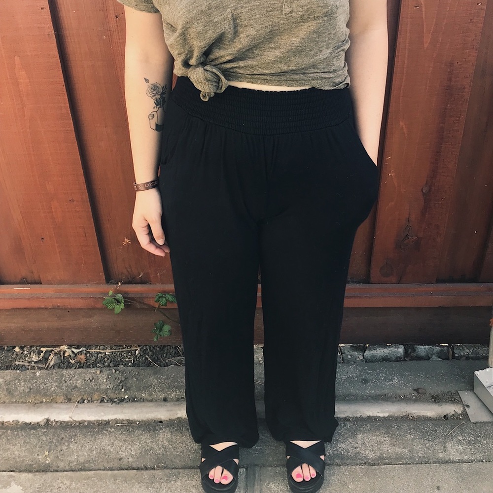 Stretchy, black wide leg pants .